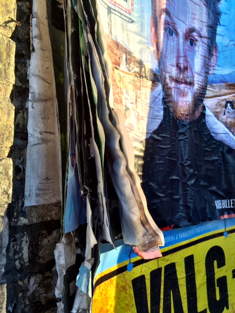 Stacks and stacks of posters outside Christiania.